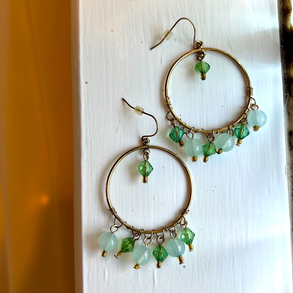 Green and gold tone dangle hoop earrings